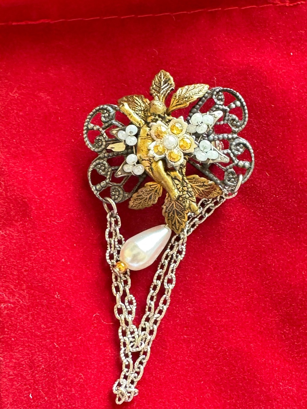 Vintage Cara Stummel Gold Tone Cupid Floral Pearl Drop Brooch with Chain Accent